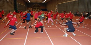 Bob Wood working with a group of young sports kids